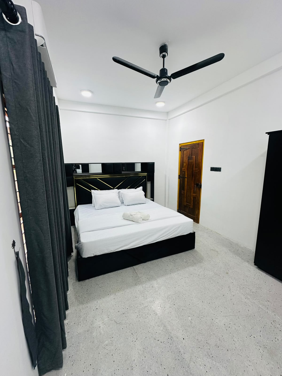 Bedroom photographed from the corner showing full sleeping area