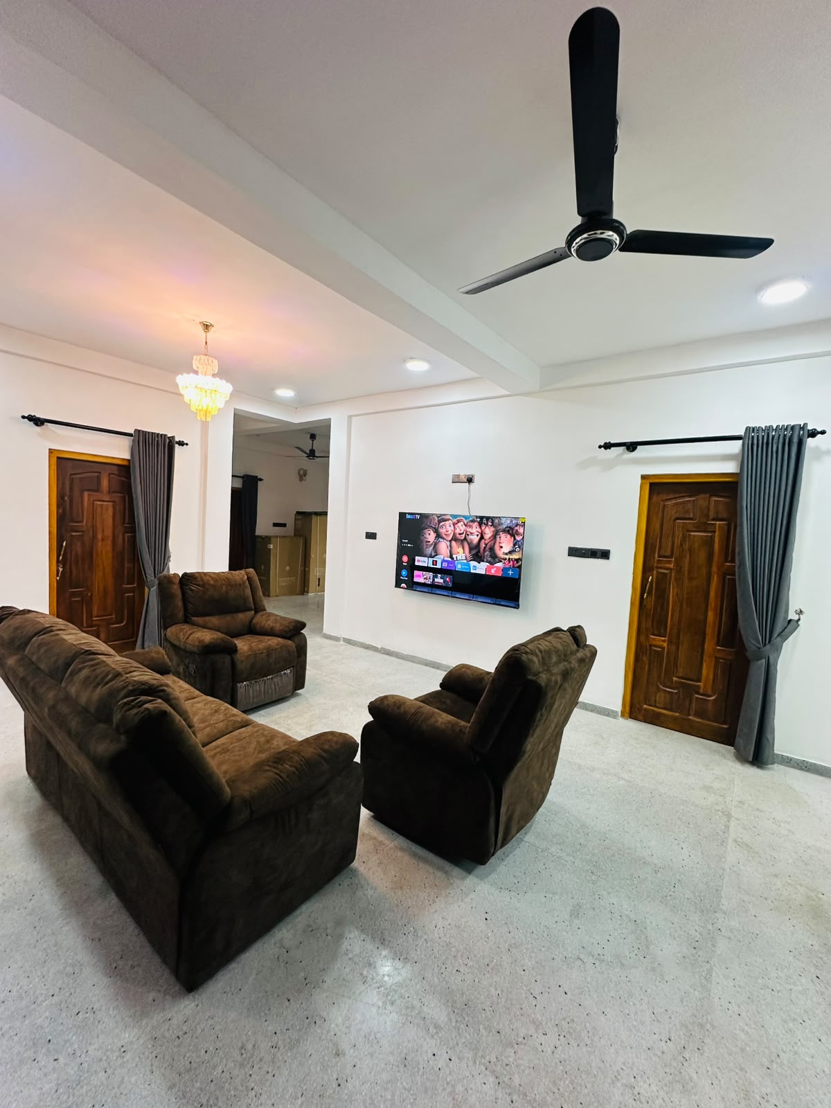 Bright lounge with sofa seating and staircase detail